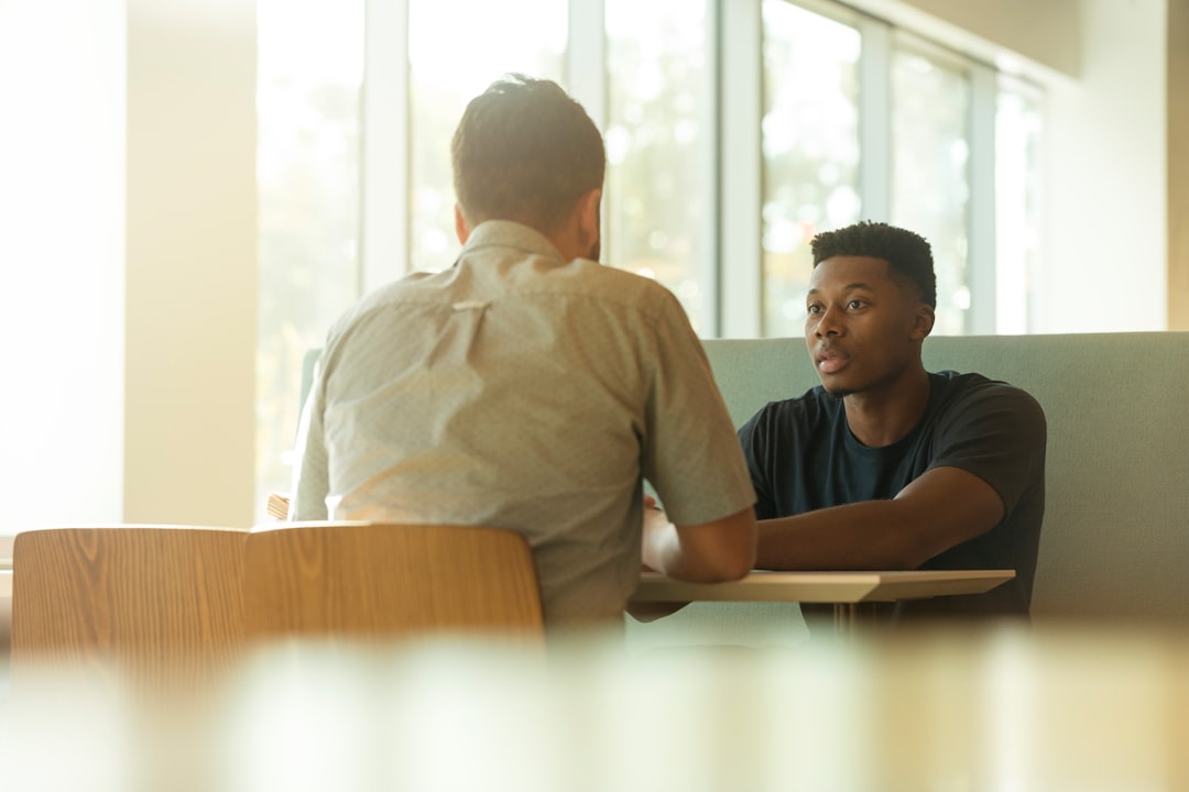 Two men in a serious one on one conversation representing Army leader counseling