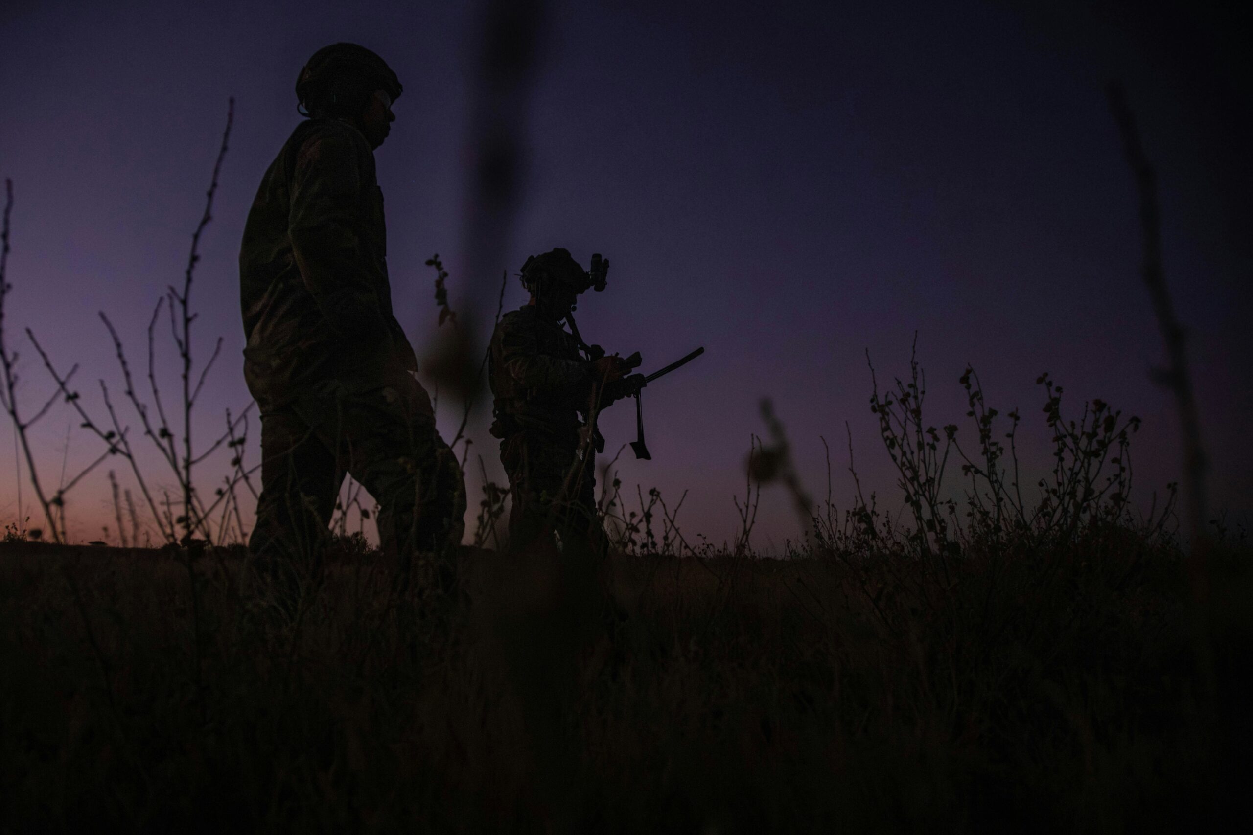 Soldiers in field during dusk